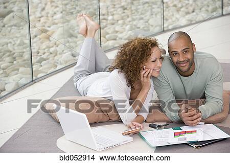 African couple working at home View Large Photo Image Picture - African couple working at home. Fotosearch
