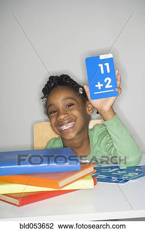 African girl holding addition flash cards View Large Photo Image Stock Image - African girl holding addition flash cards. Fotosearch
