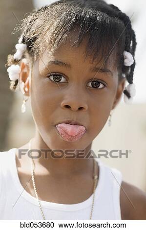 African girl sticking out tongue View Large Photo Image Stock Image - African girl sticking out tongue. Fotosearch
