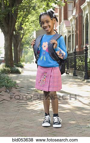 African girl wearing backpack View Large Photo Image Stock Photo - African girl wearing backpack. Fotosearch