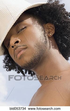 Picture - African man with hat. Fotosearch