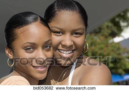 African teenaged girls hugging View Large Photo Image Stock Image - African teenaged girls hugging. Fotosearch