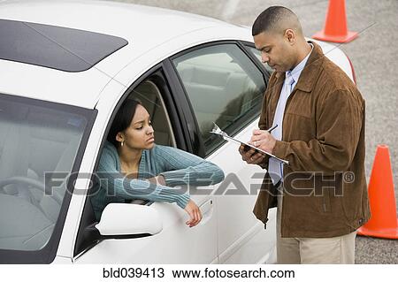 Stock Image - African teenager at drivers test. Fotosearch