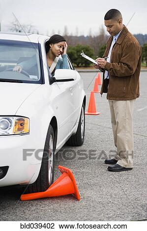 African teenager running over traffic cone at drivers test View Large Photo Image Stock Image - African teenager running over traffic cone at drivers test. Fotosearch