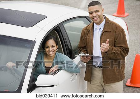 Stock Image - African teenager taking drivers test. Fotosearch