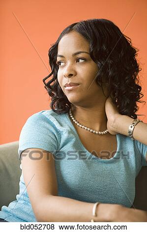 Stock Photo - African woman looking to side. Fotosearch