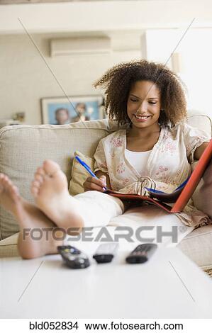 African woman working at home View Large Photo Image Picture - African woman working at home. Fotosearch