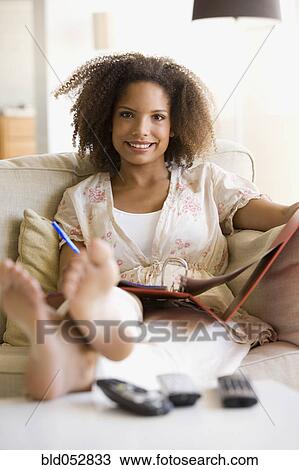 African woman working at home View Large Photo Image Stock Image - African woman working at home. Fotosearch