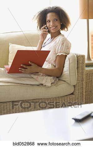 African woman working at home View Large Photo Image Stock Photo - African woman working at home. Fotosearch