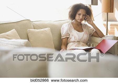 African woman working at home View Large Photo Image Stock Photograph - African woman working at home. Fotosearch