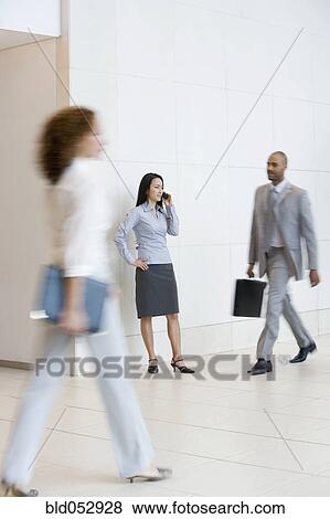 Asian businesswoman talking on cell phone View Large Photo Image Stock Photo - Asian businesswoman talking on cell phone. Fotosearch