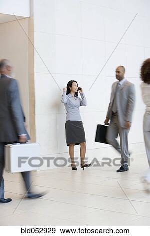 Asian businesswoman talking on cell phone View Large Photo Image Stock Photo - Asian businesswoman talking on cell phone. Fotosearch