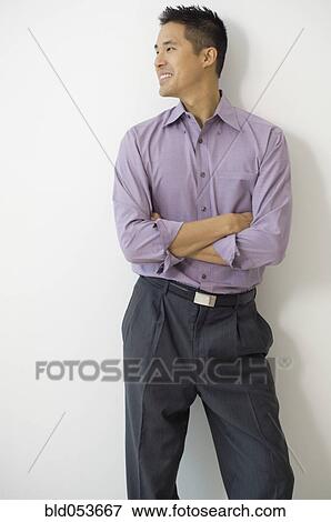 Asian man with arms crossed View Large Photo Image Stock Photo - Asian man with arms crossed. Fotosearch