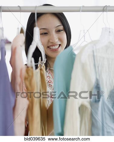 Asian woman clothing shopping View Large Photo Image Stock Photography - Asian woman clothing shopping . Fotosearch