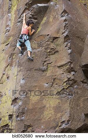 Asian woman rock climbing View Large Photo Image Stock Image - Asian woman rock climbing. Fotosearch