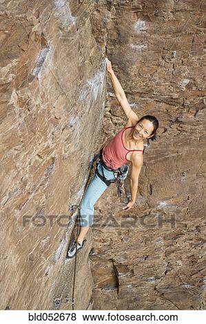 Asian woman rock climbing View Large Photo Image Stock Photo - Asian woman rock climbing. Fotosearch