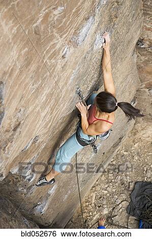 Asian woman rock climbing View Large Photo Image Stock Photograph - Asian woman rock climbing. Fotosearch