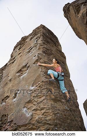 Asian woman rock climbing View Large Photo Image Stock Photography - Asian woman rock climbing. Fotosearch