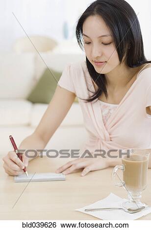 Asian woman writing letter View Large Photo Image Stock Photograph - Asian woman writing letter. Fotosearch
