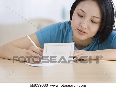 Asian woman writing Thank You card View Large Photo Image Stock Image - Asian woman writing Thank You card. Fotosearch