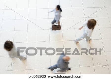 Blurred motion shot of businesspeople walking View Large Photo Image Stock Image - Blurred motion shot of businesspeople walking. Fotosearch