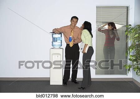 Stock Photo - Businesswoman spying on coworkers. Fotosearch