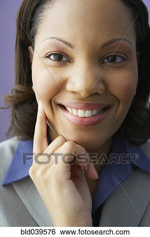 Close up of African businesswoman smiling View Large Photo Image Stock Photograph - Close up of African businesswoman smiling. Fotosearch
