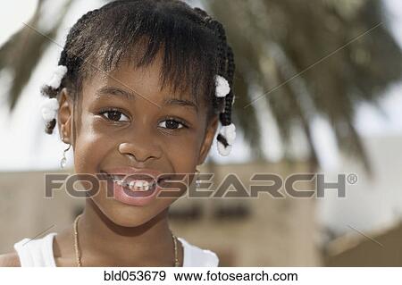 Close up of African girl smiling View Large Photo Image Stock Photo - Close up of African girl smiling. Fotosearch