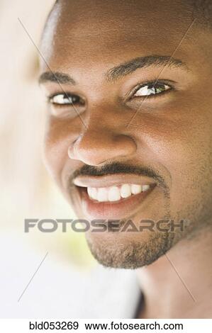 Close up of African man smiling View Large Photo Image Stock Photo - Close up of African man smiling. Fotosearch