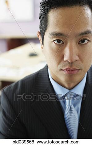Stock Photo - Close up of Asian businessman. Fotosearch