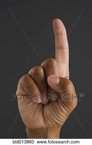 Stock Image - Close up of finger pointing. Fotosearch