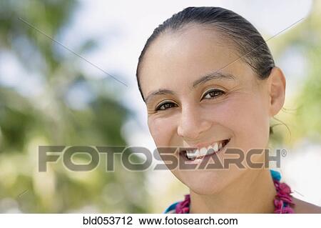 Stock Image - Close up of Hispanic woman smiling. Fotosearch