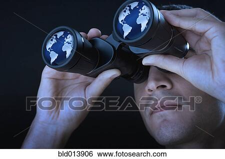Close up of man looking at world through binoculars View Large Photo Image Stock Photograph - Close up of man looking at world through binoculars. Fotosearch
