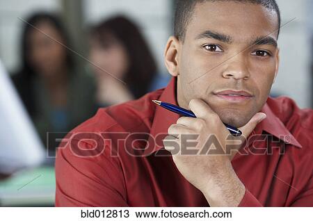 Close up of thoughtful young man View Large Photo Image Stock Image - Close up of thoughtful young man. Fotosearch