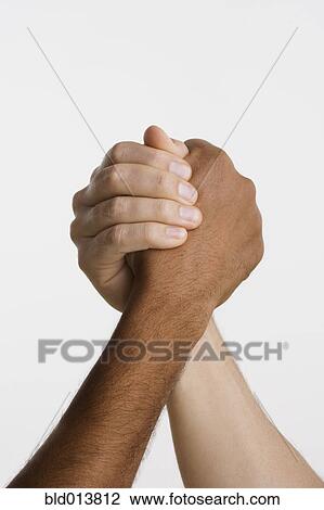 Close up of two hands in arm wrestle View Large Photo Image Stock Image - Close up of two hands in arm wrestle. Fotosearch
