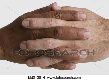 Close up of two hands interlocking View Large Photo Image Picture - Close up of two hands interlocking. Fotosearch