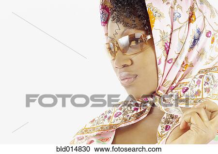 Close up of woman with scarf on head wearing sunglasses View Large Photo Image Stock Image - Close up of woman with scarf on head wearing sunglasses. Fotosearch