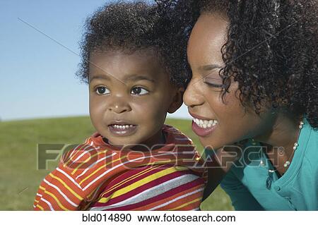 Close up of woman with young son View Large Photo Image Stock Image - Close up of woman with young son. Fotosearch