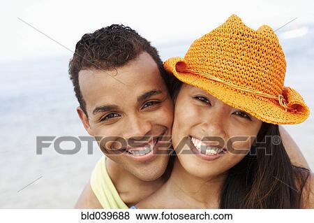 Couple hugging at beach View Large Photo Image Stock Photo - Couple hugging at beach. Fotosearch