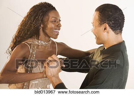 Couple laughing and dancing View Large Photo Image Stock Photo - Couple laughing and dancing. Fotosearch