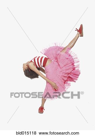 Stock Photo - Full view of woman kicking high in air. Fotosearch
