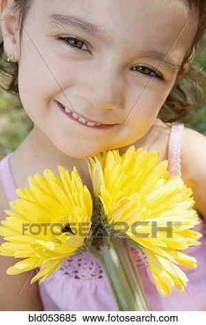 Girl holding flowers View Large Photo Image Stock Photography - Girl holding flowers. Fotosearch