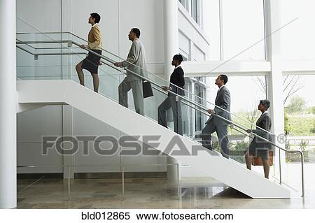 Group of business people climbing stairs View Large Photo Image Stock Photography - Group of business people climbing stairs. Fotosearch