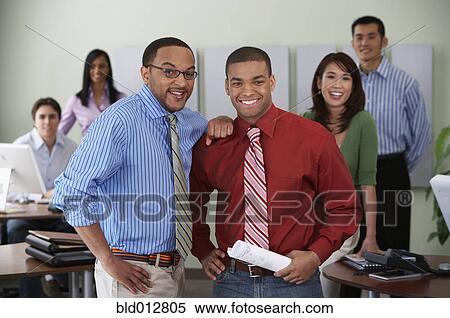 Group of office coworkers smiling at camera View Large Photo Image Stock Photography - Group of office coworkers smiling at camera. Fotosearch