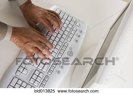 High angle view of businessman's hands on keyboard View Large Photo Image Stock Photography - High angle view of businessman's hands on keyboard. Fotosearch