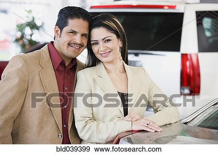 Hispanic couple at car dealership View Large Photo Image Stock Photo - Hispanic couple at car dealership. Fotosearch