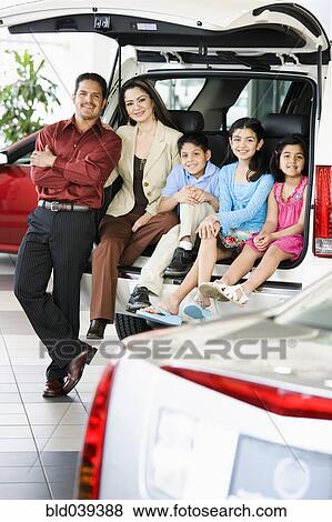 Hispanic family at car dealership View Large Photo Image Stock Photo - Hispanic family at car dealership. Fotosearch