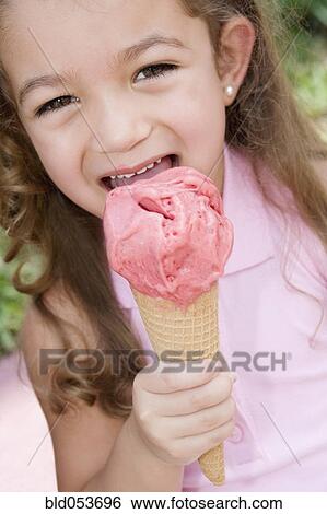 Hispanic girl eating ice cream cone View Large Photo Image Stock Photograph - Hispanic girl eating ice cream cone. Fotosearch