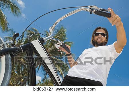 Hispanic man on bicycle View Large Photo Image Stock Photo - Hispanic man on bicycle. Fotosearch
