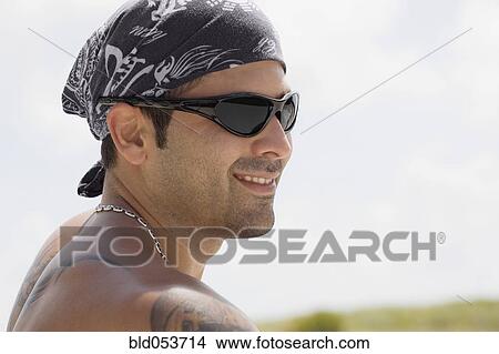 Hispanic man wearing sunglasses View Large Photo Image Picture - Hispanic man wearing sunglasses. Fotosearch